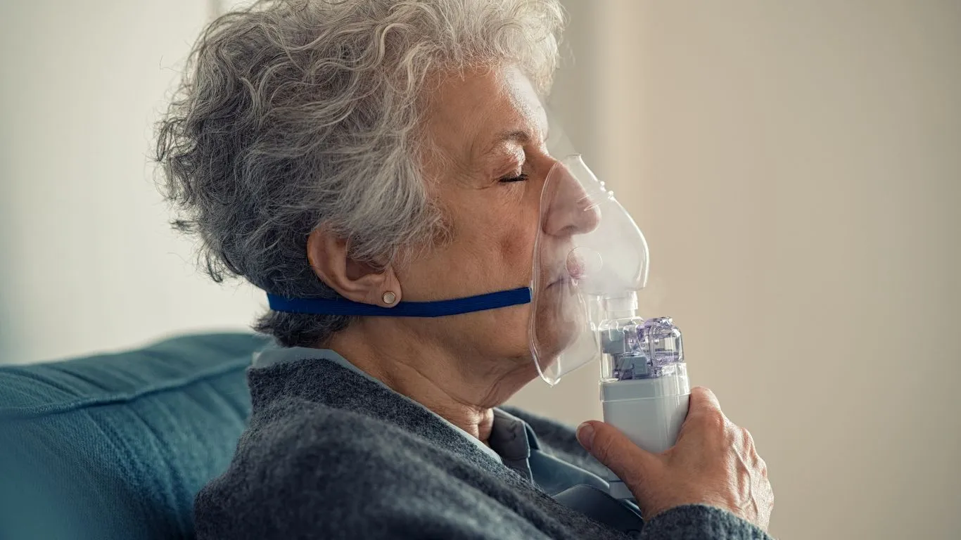 Person using an inhaler for asthma relief