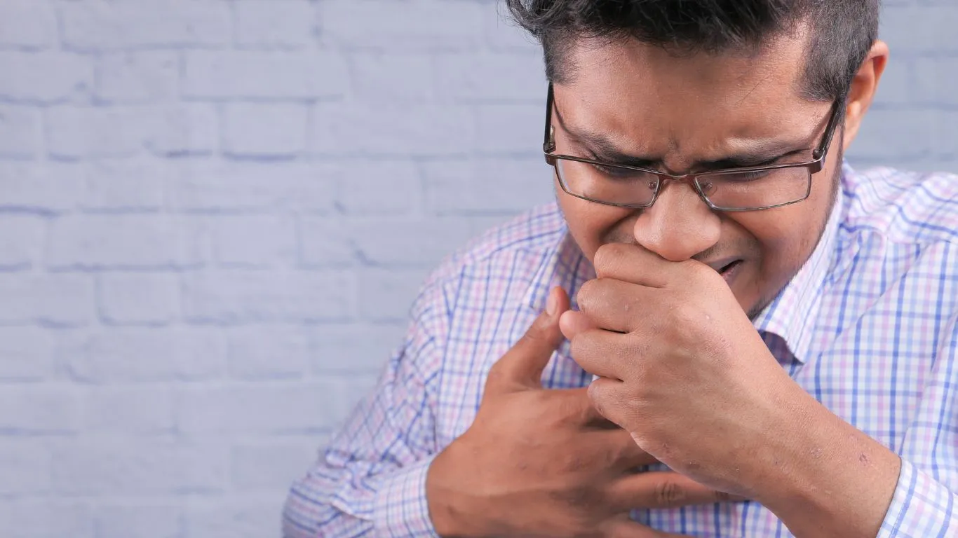 Humidifier for asthma relief with a person breathing easily