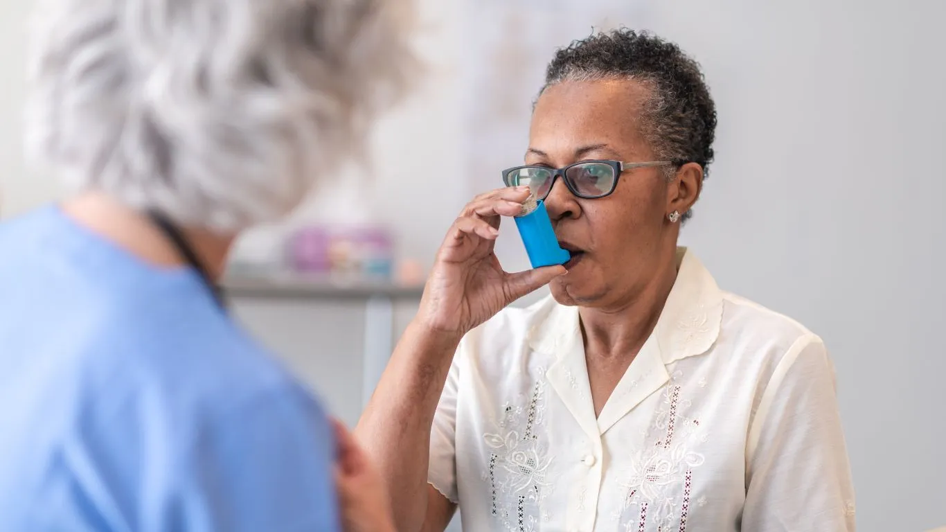 A person practicing yoga breathing for asthma relief