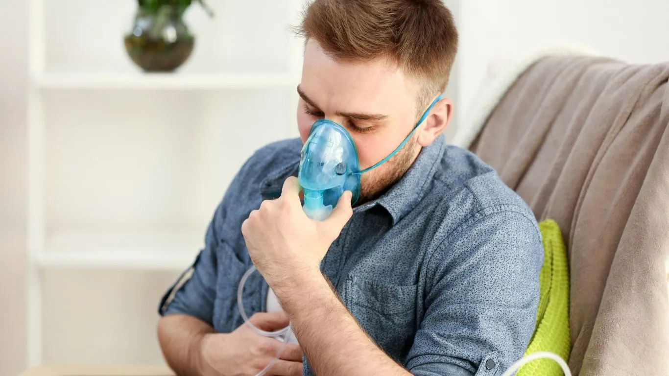 Person doing yoga for asthma management