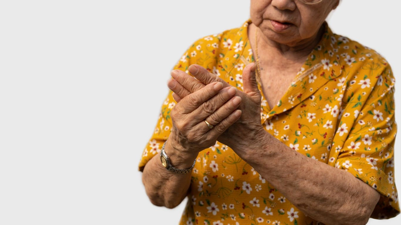 Person using herbal remedies as part of rheumatoid arthritis treatment