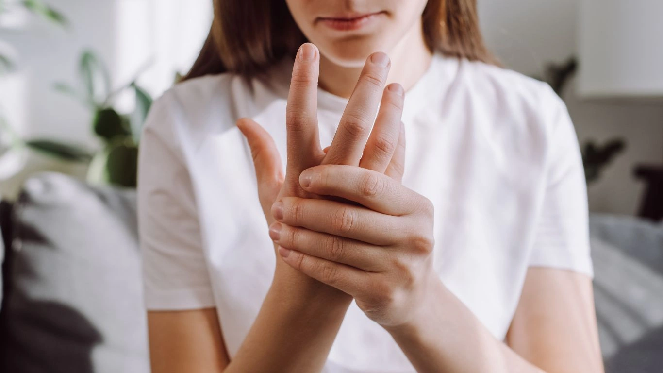 A healthcare professional reviewing an X-ray to diagnose rheumatoid arthritis