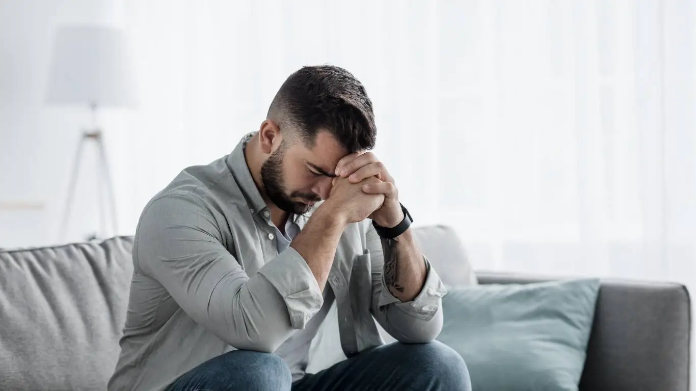Flat lay of self-help tools like journal, herbal tea, and mindfulness cards